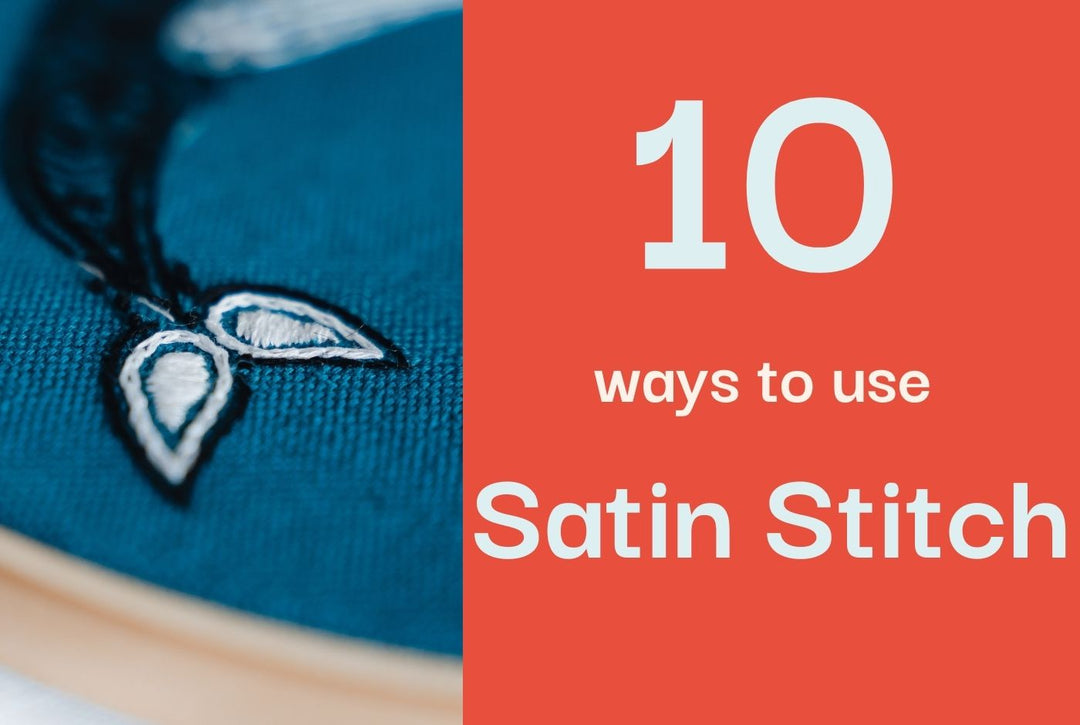 A close up of an embroidered whale tail on teal fabric.