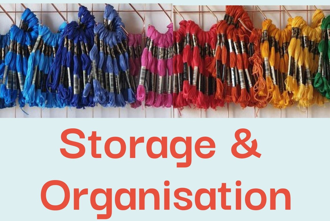 A photo of a range of colourful embroidery threads hanging on a wall display.