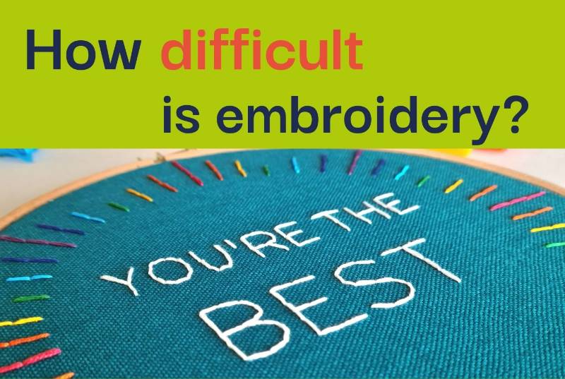 A bright piece of embroidery on teal fabric with the phrase 'you're the best' stitched on it sits below text saying 'how difficult is embroidery?'.