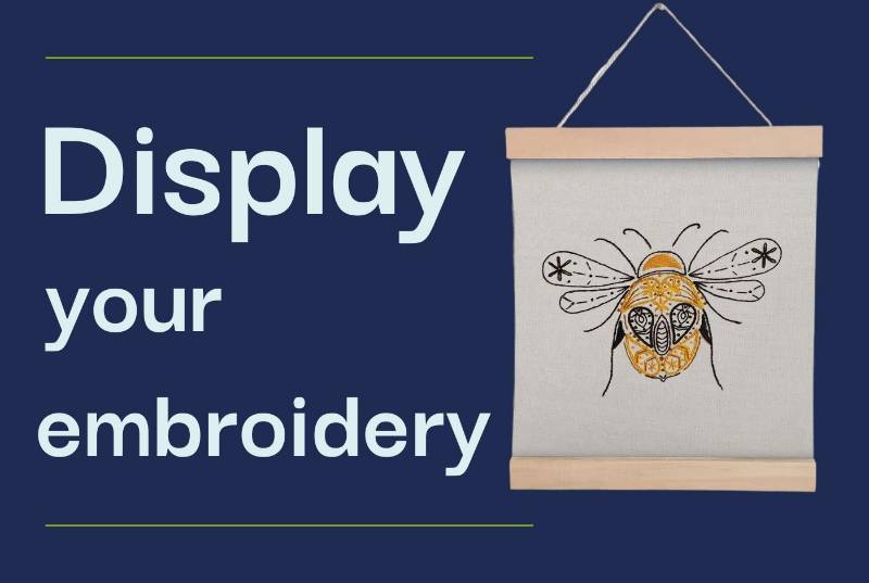 An embroidered Paraffle bee banner hangs against a navy background with text saying 'display your embroidery'.