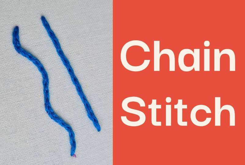 A photo of chain stitch embroidered in blue thread on a white fabric.