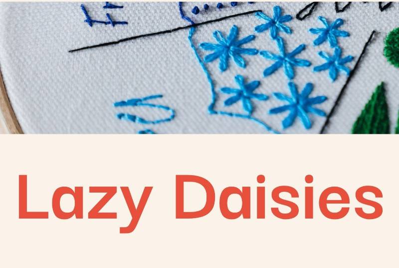 A photo of lazy daisy stitch embroidered with bright blue thread and accompanying text.