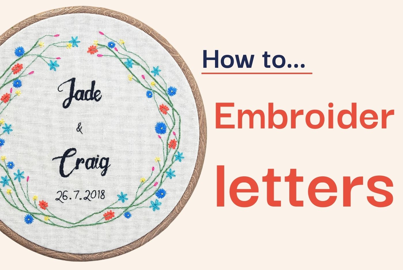 An embroidery hoop stitched with flowers and names for a wedding gift.