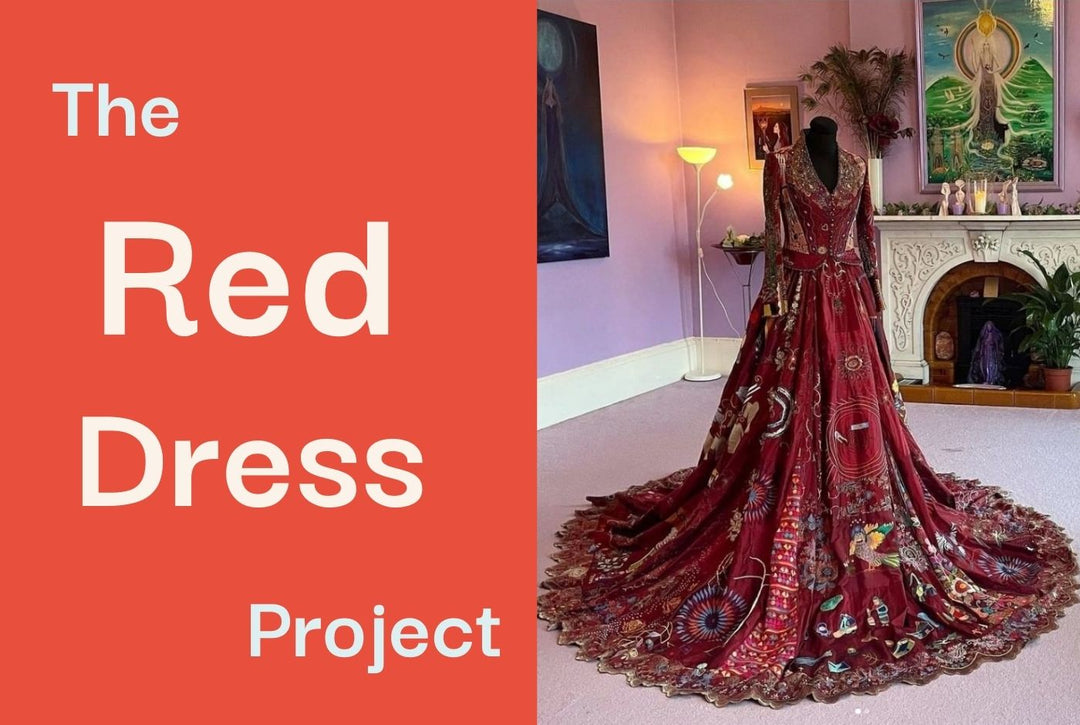 A photo of an embroidered red dress on a mannequin.