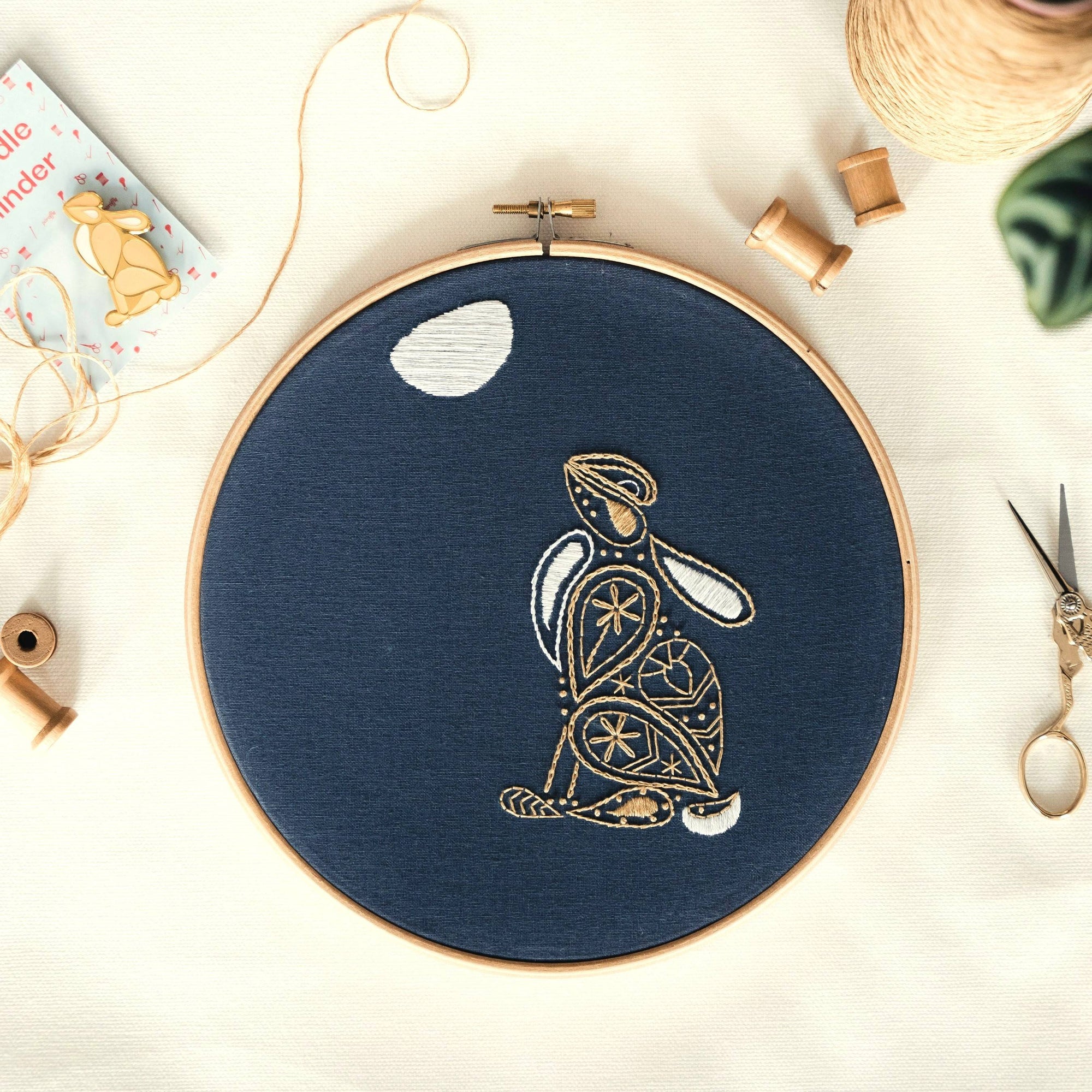 Hare embroidery design on a cream background