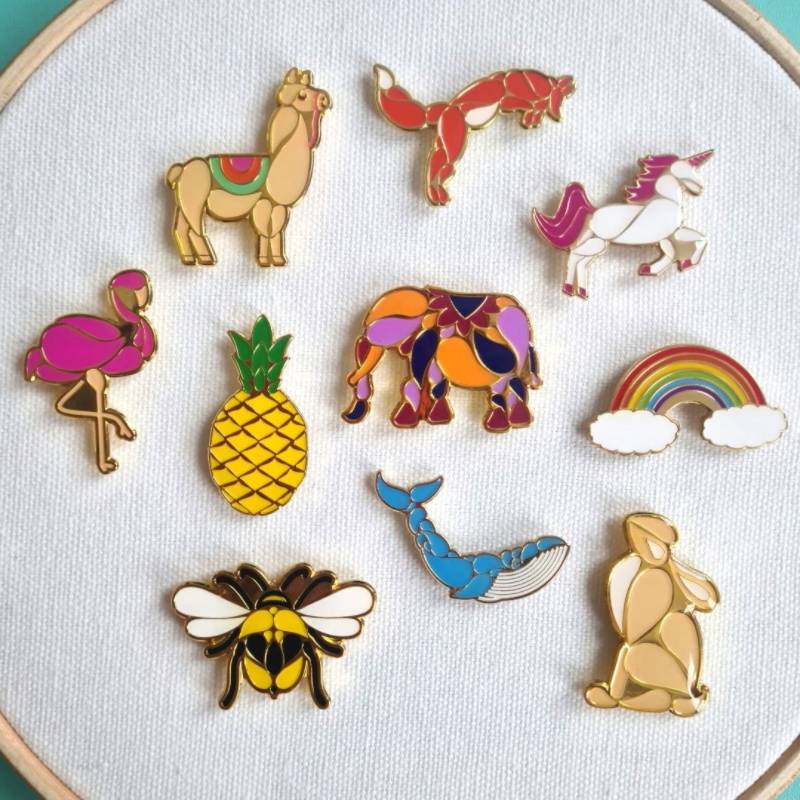 Ten of Paraffle's needle minders on a embroidery hoop
