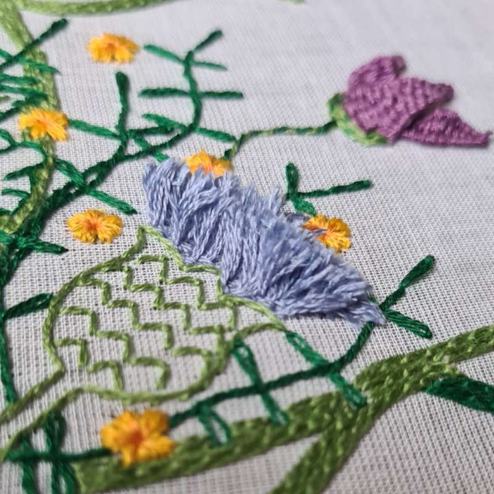 thistle embroidered on voile fabric